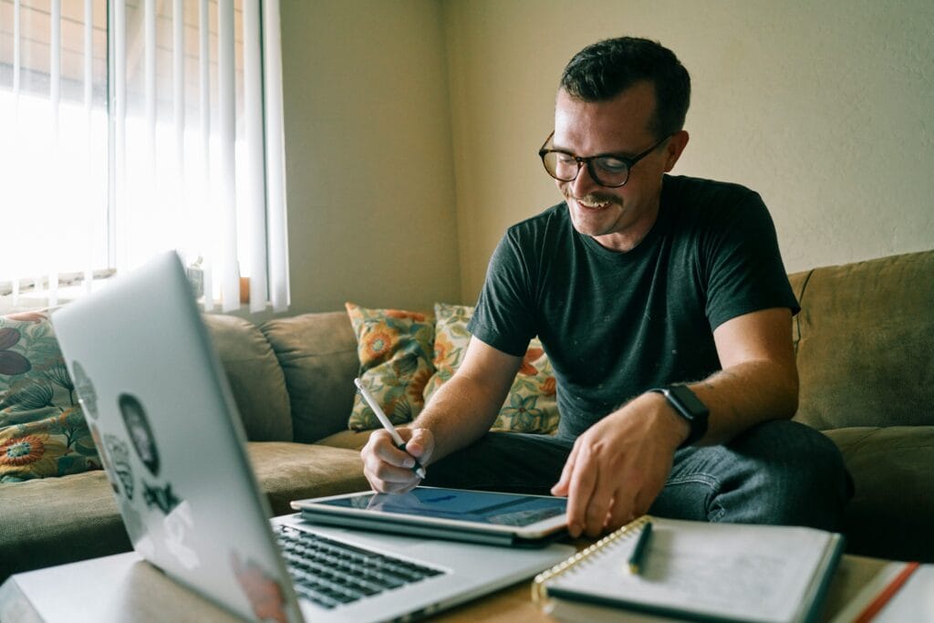 Freelancer working on a laptop reviewing finance and tax tools