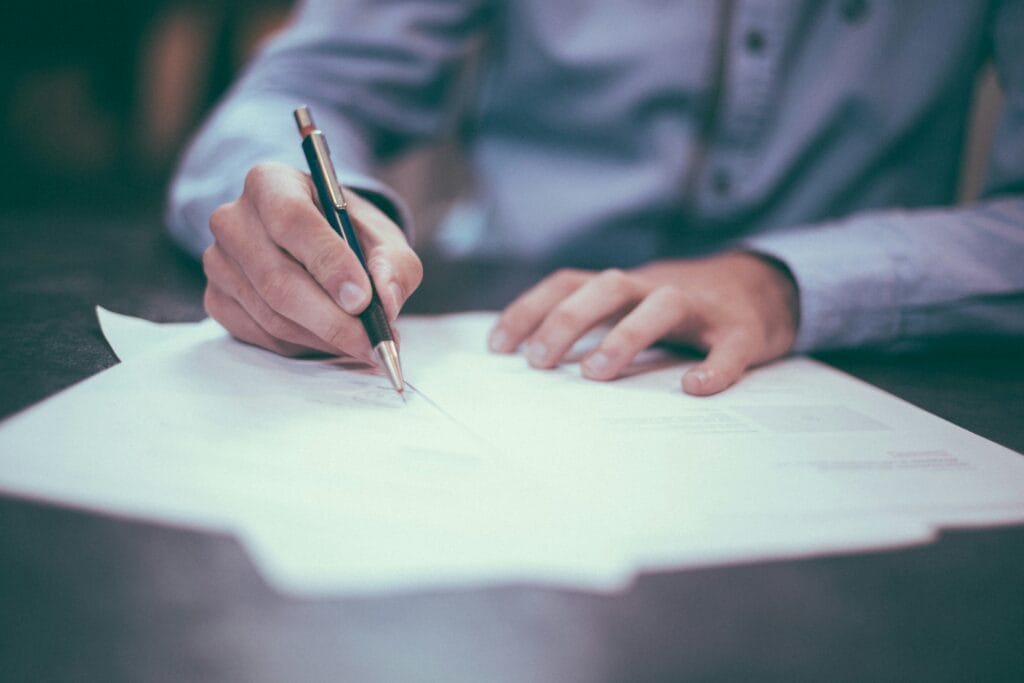 Printable freelancer bookkeeping cost comparison checklist on a desk